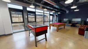a room with a ping pong table and pool tables at Twerton Mill in Bath 7 Min Bus to City Centre in Bath