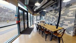 a dining room with a wooden table and chairs at Twerton Mill in Bath 7 Min Bus to City Centre in Bath