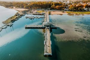 an aerial view of a pier in the water at BlueApart Apartamenty Nexo in Puck