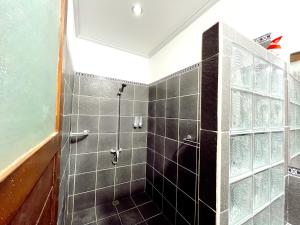 Een badkamer bij Joker Guest House