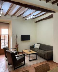 a living room with a couch and a table at Casa Monovar in Monóvar