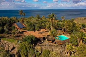 an aerial view of a resort with a swimming pool and the ocean at Redondo de Guayedra in Guayedra
