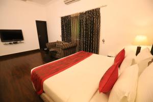 Postel nebo postele na pokoji v ubytování Hotel Capitol Hills - Greater Kailash Delhi