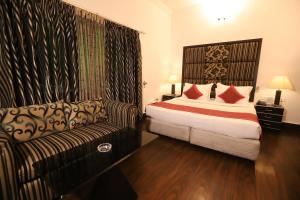 Postel nebo postele na pokoji v ubytování Hotel Capitol Hills - Greater Kailash Delhi