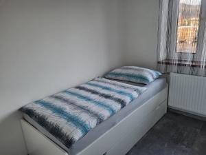 Postel nebo postele na pokoji v ubytování Apartment Karin, Eigener Eingang, 3 Schlafzimmer, Doppelcarport