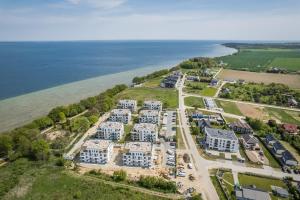 an aerial view of a resort next to the water at BlueApart Willa Kaprów Puck in Puck