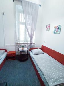 Łóżko lub łóżka w pokoju w obiekcie Apartaments Piotrkowska 101