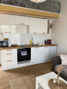 Kuchyňa alebo kuchynka v ubytovaní Logement avec mezzanine
