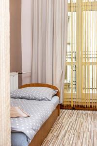 Łóżko lub łóżka w pokoju w obiekcie Apartaments Piotrkowska 101