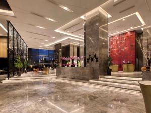 a lobby of a hotel with a large lobby at Sofitel Kuala Lumpur Damansara in Kuala Lumpur