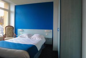 Postel nebo postele na pokoji v ubytování Le CESAR HOTEL