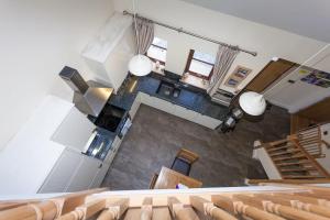 an overhead view of an auditorium with chairs and a staircase at Laurel Cottage at Williamscraig Holiday Cottages in Linlithgow