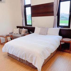 Rúm í herbergi á Landay Homestay