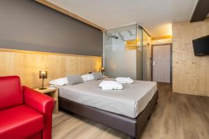 Postel nebo postele na pokoji v ubytování Hotel Piandineve