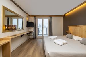 Postel nebo postele na pokoji v ubytování Hotel Piandineve