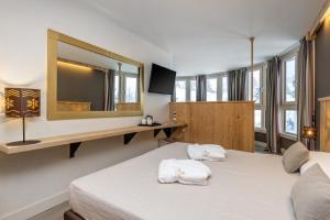 Postel nebo postele na pokoji v ubytování Hotel Piandineve