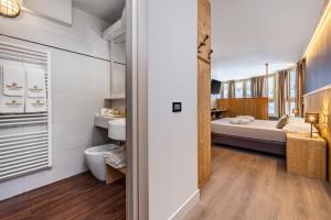 Postel nebo postele na pokoji v ubytování Hotel Piandineve