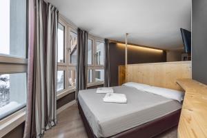 Postel nebo postele na pokoji v ubytování Hotel Piandineve