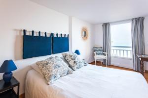 Posteľ alebo postele v izbe v ubytovaní La Baignade - vue mer