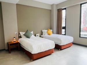 Katil atau katil-katil dalam bilik di Rooms Homestay
