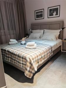 A bed or beds in a room at Borovete Mountain Luxury