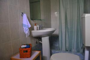 a bathroom with a sink and a toilet and a shower at MagnoliaHouse 1 in Preveza +33 photos
