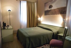 Postel nebo postele na pokoji v ubytování Hotel Valbrenta
