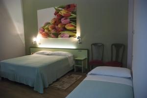 Postel nebo postele na pokoji v ubytování Hotel Valbrenta