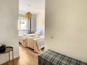 Un ou plusieurs lits dans un hébergement de l'établissement Casa Pico dos Barcelos by LovelyStay