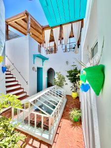 a view from the balcony of a house with a staircase at Darna Hostel in Tetouan