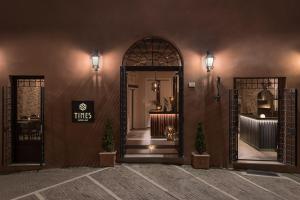 an entrance to a restaurant with two entry doors at Times Suites & Bar in Perugia