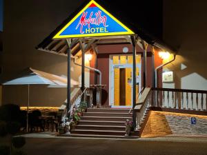 a hotel sign on the front of a building at Hotel Medaillon in Magdeburg