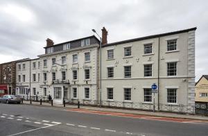 a large white building on the side of a street at iQ Ty Willis House in Bangor 3 Min Walk to Bangor Station in Bangor
