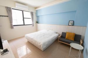 Postel nebo postele na pokoji v ubytování Yuhai B&B