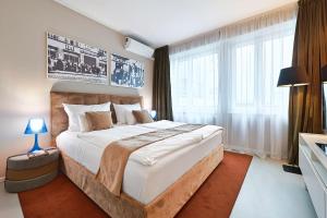 Postel nebo postele na pokoji v ubytování HeyMi Apartments Mondschein