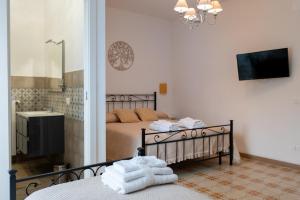 a bedroom with a bed and a bathroom with a sink at B & B L'ABBRACCIO in Agnone