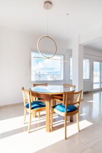 a dining room with a table and chairs at Delightful Penthouse in Athens