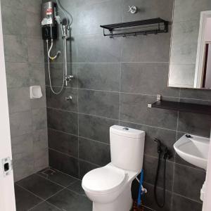 a bathroom with a toilet and a shower and a sink at SBB Star Homestay in Sungai Petani +17 photos