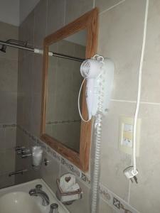 a hair dryer in a bathroom next to a sink at El Zohar 5 pax in Federación