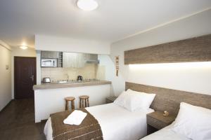 Ein Bett oder Betten in einem Zimmer der Unterkunft Rumbo Sur Apart Hotel