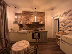 a kitchen with a sink and a stove at Westend in Ryde