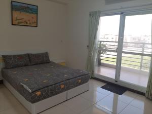 Voodi või voodid majutusasutuse Jun Le Bed and Breakfast toas