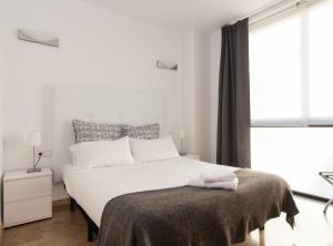 Postel nebo postele na pokoji v ubytování Picasso Suites