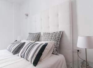Postel nebo postele na pokoji v ubytování Picasso Suites