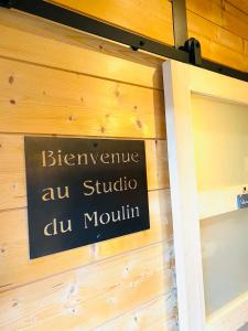 a sign on the wall of a store at Studio Du Moulin in Saint-Laurent-dʼAndenay