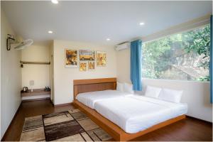 A bed or beds in a room at Ninh Binh The View Point Home & Spa