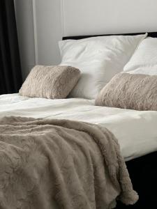 Postel nebo postele na pokoji v ubytování Apartment by Gustav