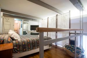 Postel nebo postele na pokoji v ubytování Loft in Testaccio