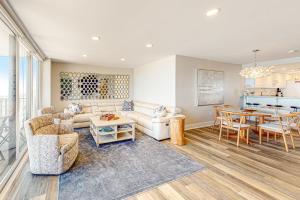a living room with a couch and a table at Sea Colony Ocean --- 1205N Edgewater House in Bethany Beach