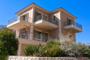 a large house with balconies on top of it at Family Villa Citrine Kefalonia - near Agia Efimia in Agia Effimia